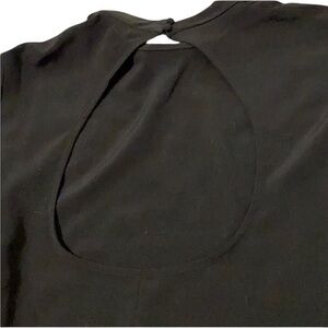 H&M size large black open back satiny like back of neck button flowy sleeve
